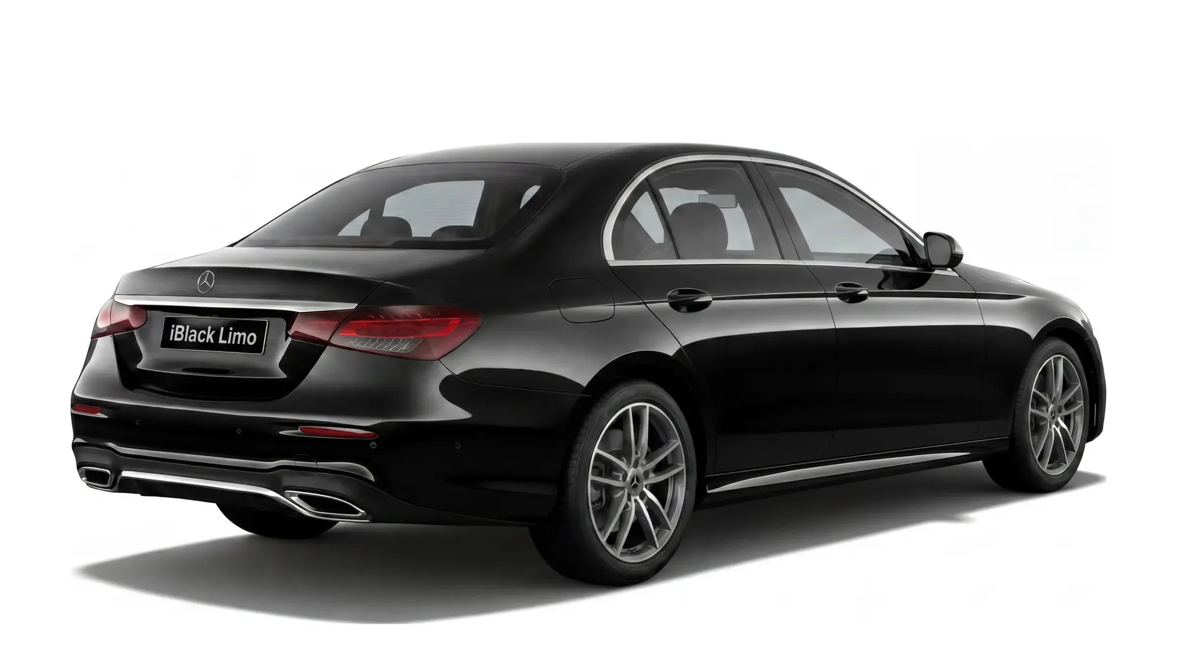 Black Mercedes-Benz E-Class luxury sedan, rear three-quarter studio view on white