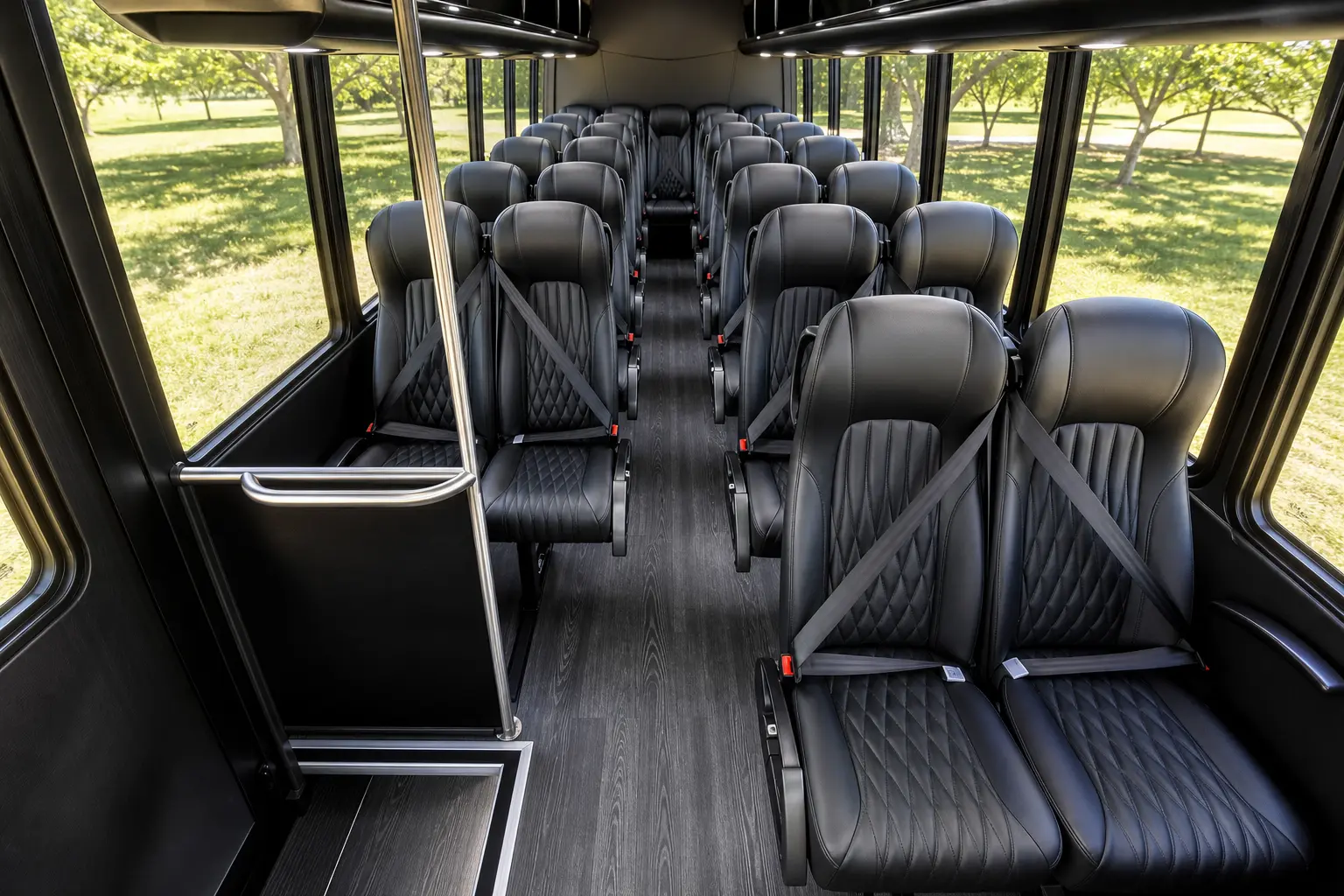 Grech GM33 mini coach interior — quilted black leather coach seats facing forward toward the cockpit