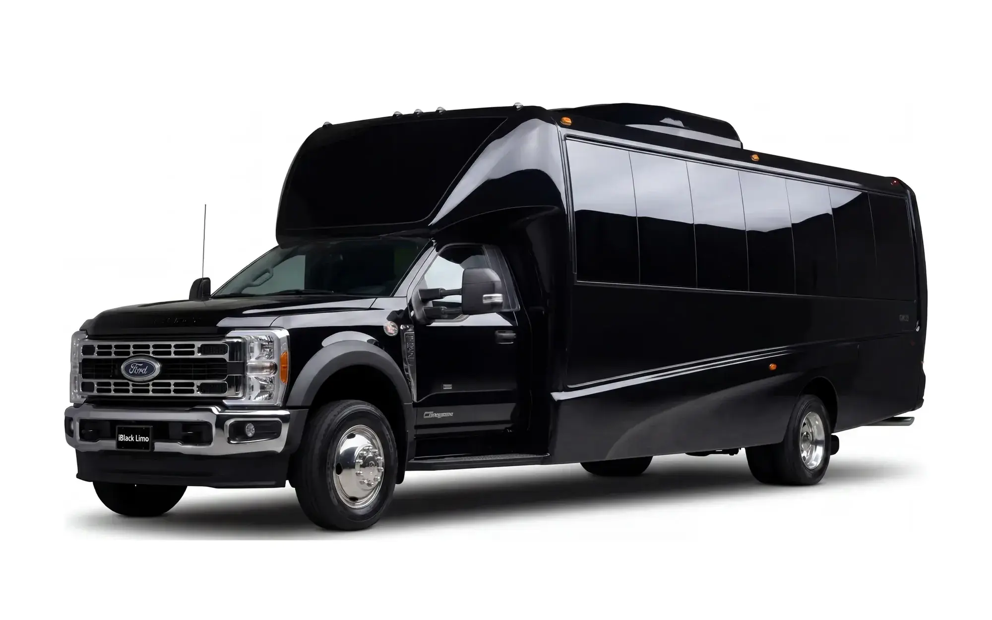 Black luxury mini coach, front three-quarter studio view on white