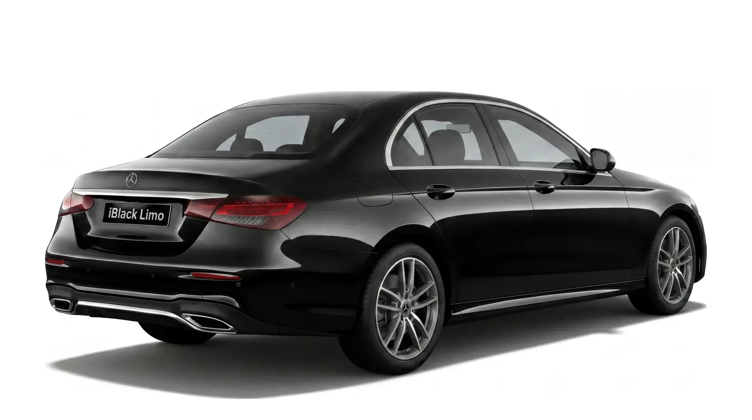 Black Mercedes-Benz E-Class luxury sedan, rear three-quarter studio view on white