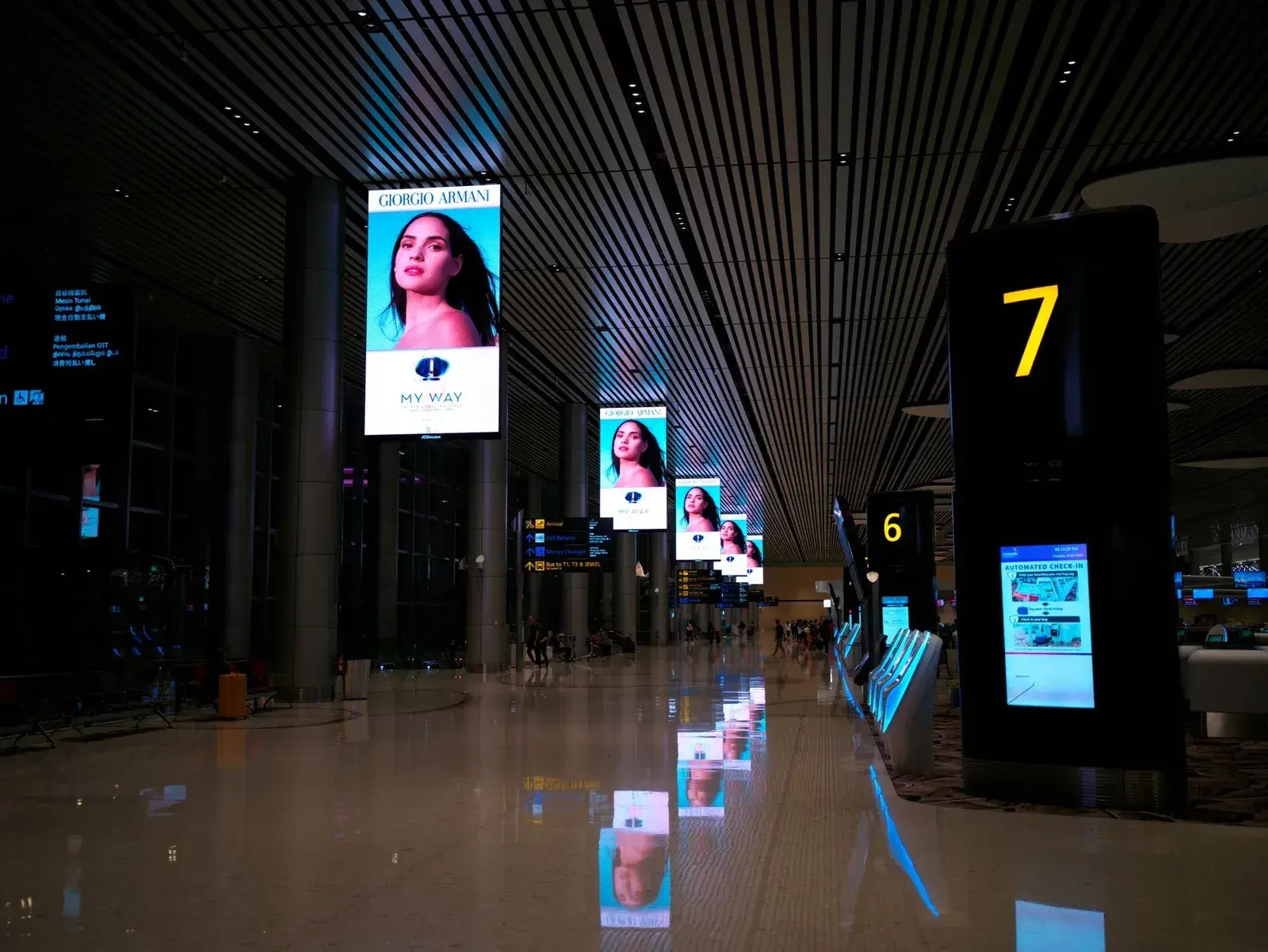 A modern airport terminal at night